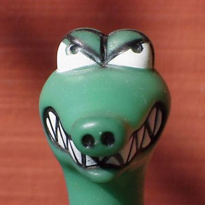 green plastic dinosaur head